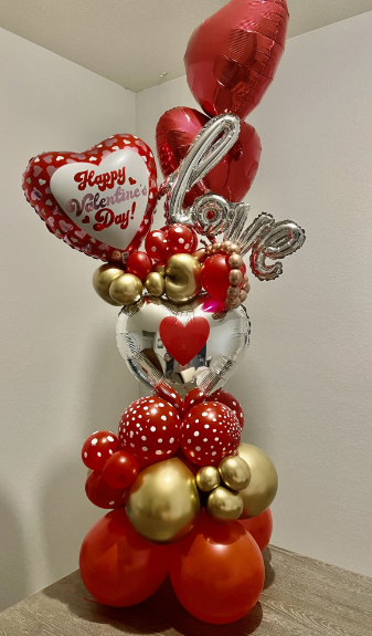 Heart-shaped Valentine's Day balloon bouquet with red, pink and white balloons